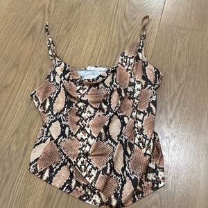 Snake print going out top with cowbell neckline